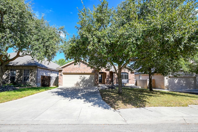 view of front of property with a garage and a front yard