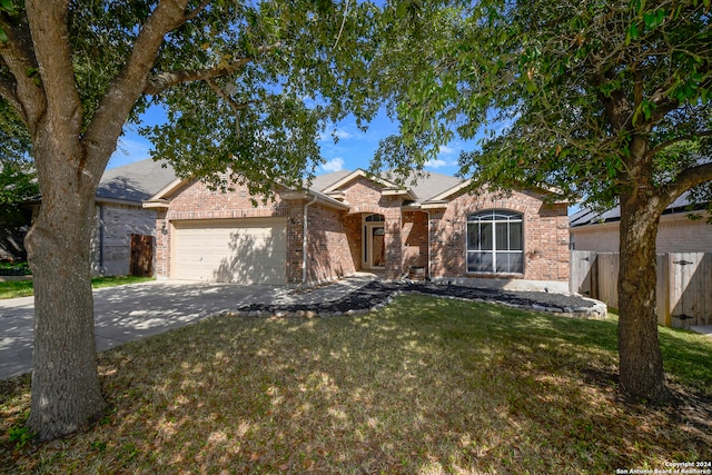 view of front facade featuring a front yard and a garage