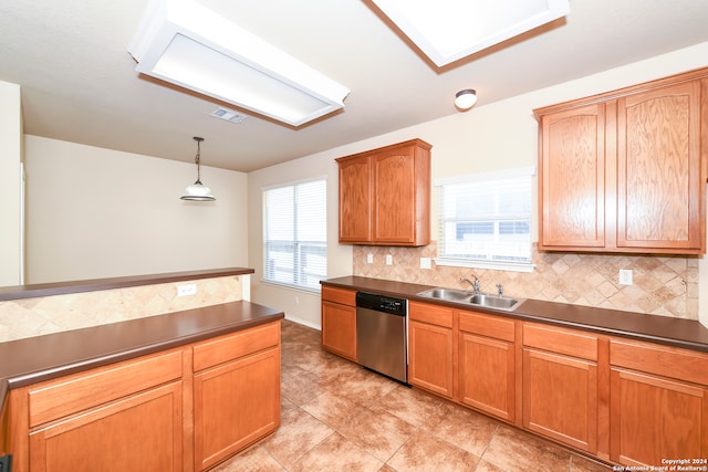 kitchen with pendant lighting, sink, stainless steel dishwasher, backsplash, and light tile patterned floors