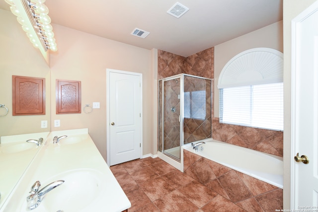 bathroom with separate shower and tub, tile patterned floors, and vanity