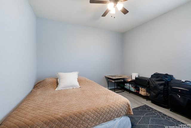 bedroom featuring ceiling fan and light hardwood / wood-style flooring