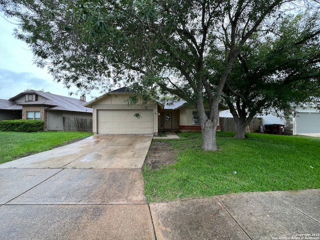 ranch-style house with a front lawn and a garage