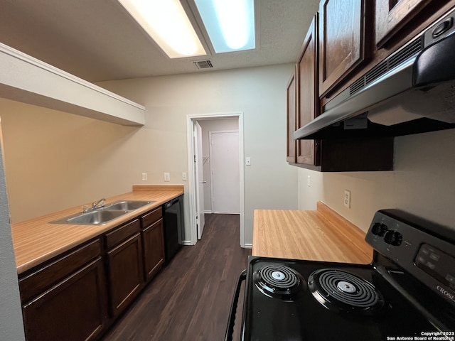 kitchen featuring dark brown cabinets, black appliances, dark hardwood / wood-style flooring, and sink