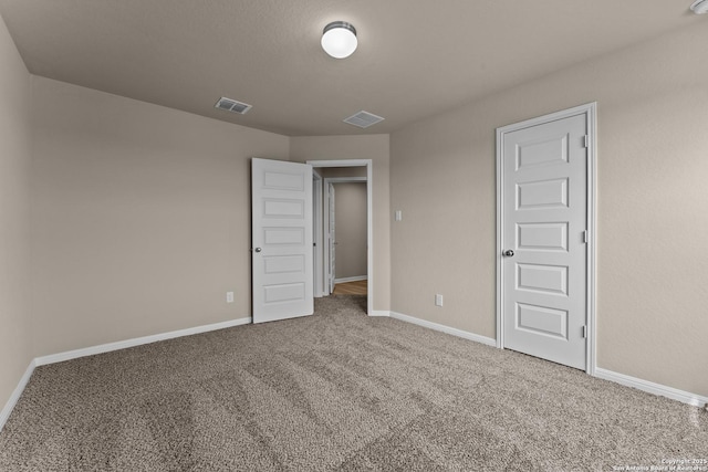 unfurnished bedroom featuring carpet