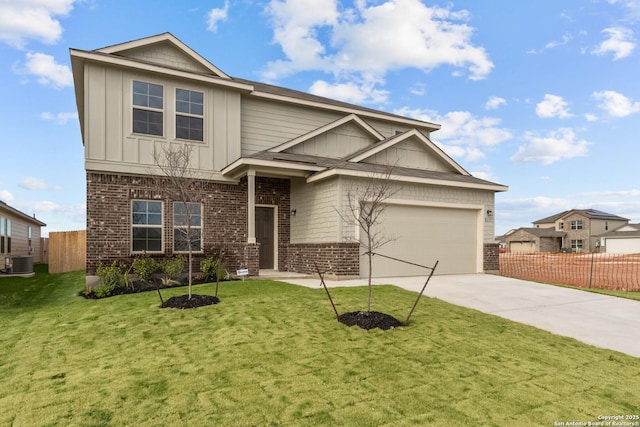 craftsman-style home with a garage, a front yard, and central air condition unit