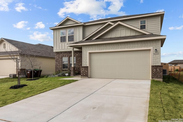 craftsman-style house with a garage and a front lawn