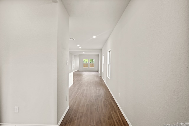 hallway with wood-type flooring