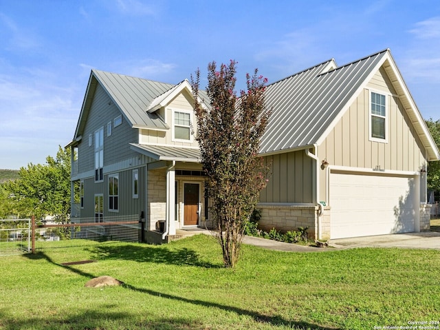 view of front of house with a front lawn and a garage