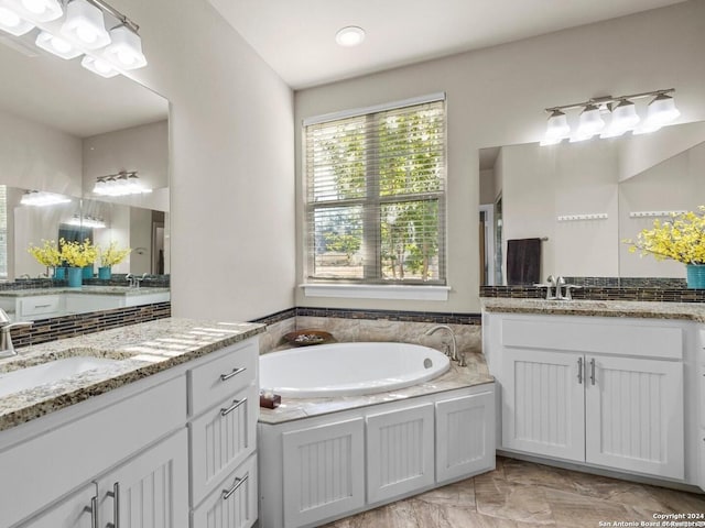 bathroom featuring a tub and vanity