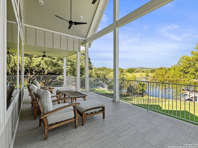 sunroom with a water view and vaulted ceiling