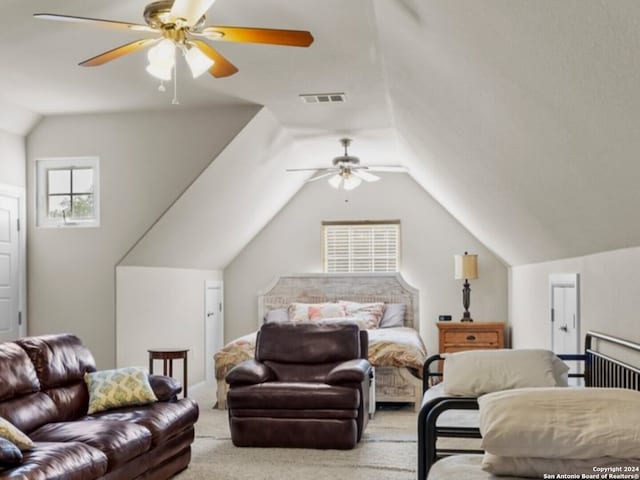 bedroom with lofted ceiling, light carpet, and ceiling fan