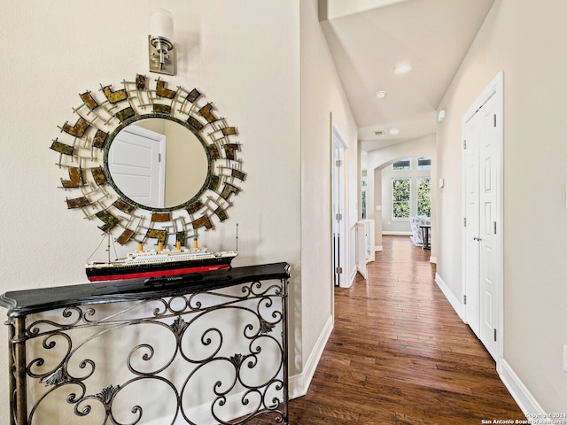 hallway with dark hardwood / wood-style flooring