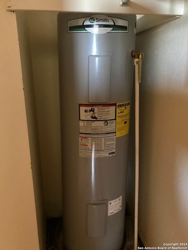 utility room with electric water heater