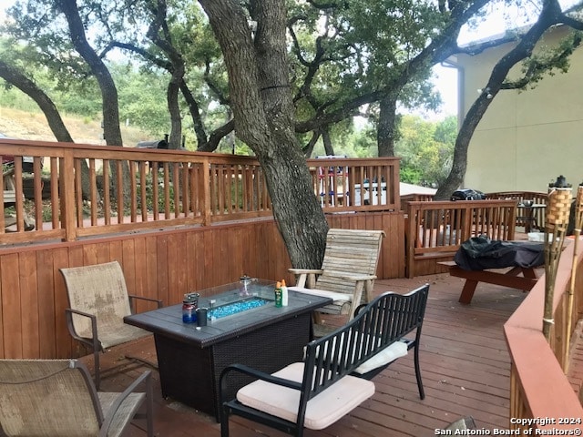 deck featuring a fire pit