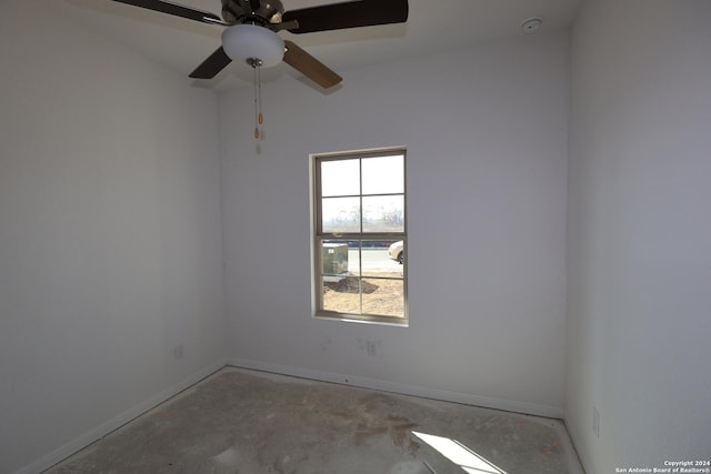 10335 Tule Creek Frk, San Antonio, TX 78252 - spare room with baseboards, concrete floors, and a ceiling fan