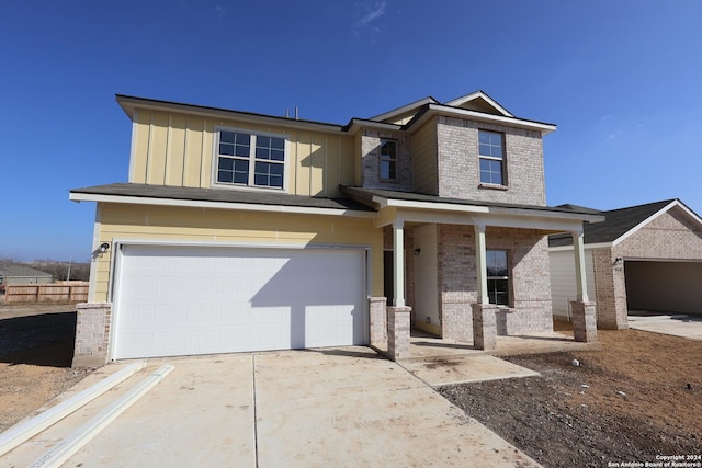 10335 Tule Creek Frk, San Antonio, TX 78252 - craftsman inspired home with an attached garage, concrete driveway, a porch, brick siding, and board and batten siding