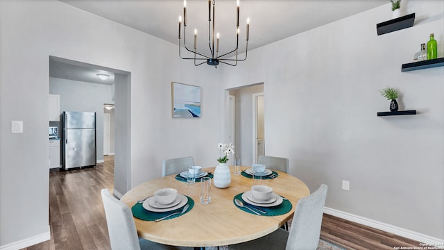 dining room with dark hardwood / wood-style flooring