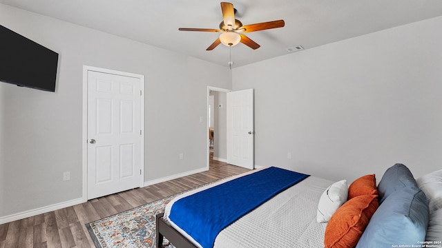 bedroom featuring ceiling fan and hardwood / wood-style floors