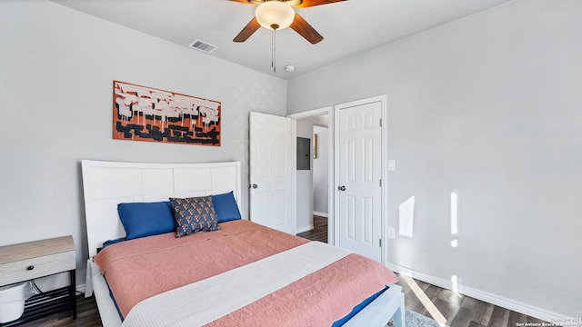 bedroom featuring dark hardwood / wood-style flooring and ceiling fan