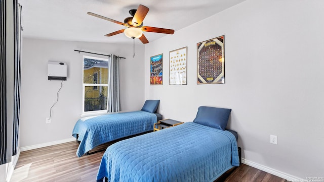 bedroom with lofted ceiling, ceiling fan, hardwood / wood-style floors, and heating unit