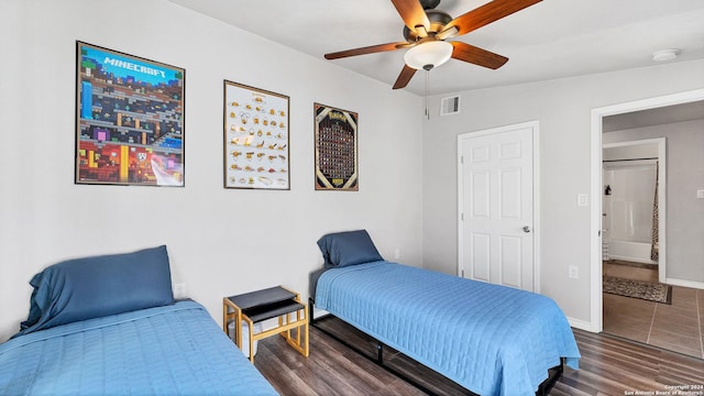 bedroom with ceiling fan and dark hardwood / wood-style flooring