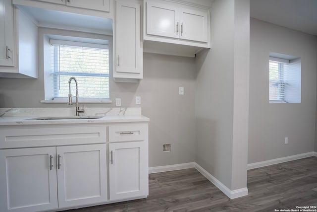 kitchen featuring dark wood-type flooring and white cabinetry