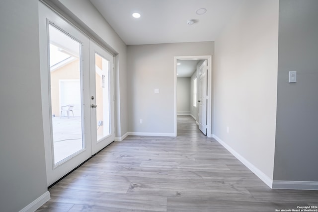 entryway featuring french doors and light hardwood / wood-style floors