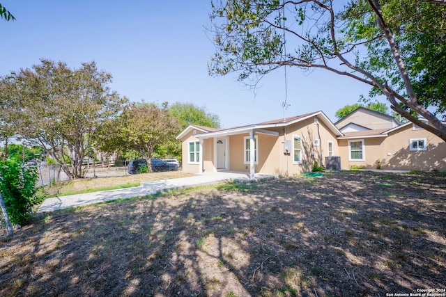 rear view of house with a patio and central air condition unit