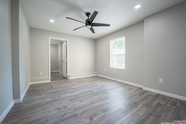 unfurnished room with light hardwood / wood-style floors and ceiling fan