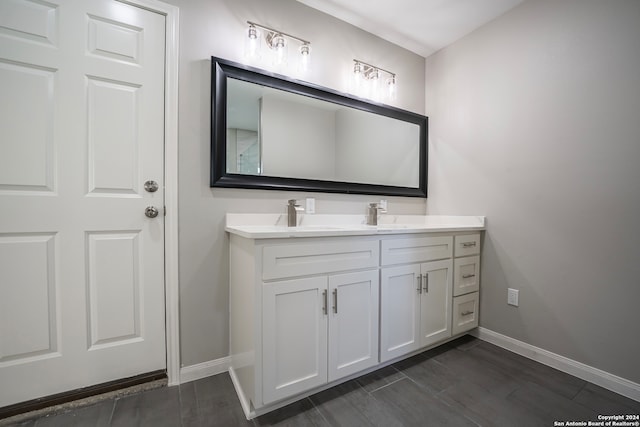 bathroom featuring wood-type flooring and vanity