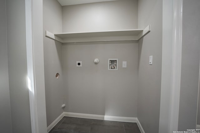 laundry room featuring washer hookup, dark tile patterned floors, hookup for a gas dryer, and electric dryer hookup