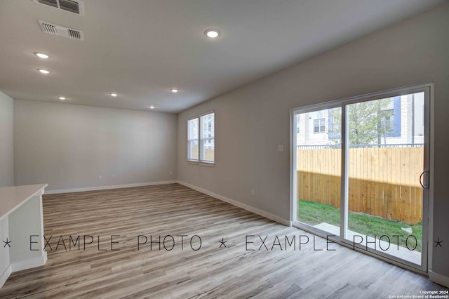 spare room with light wood-type flooring