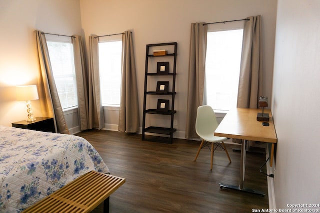 bedroom featuring dark hardwood / wood-style flooring