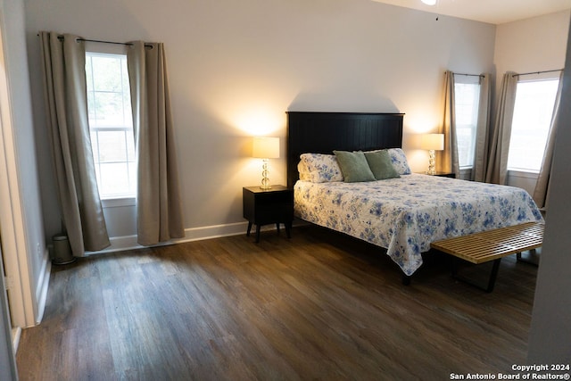 bedroom featuring dark hardwood / wood-style flooring