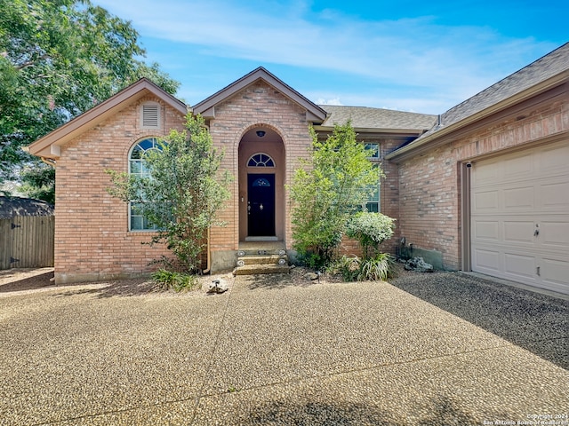 single story home with a garage