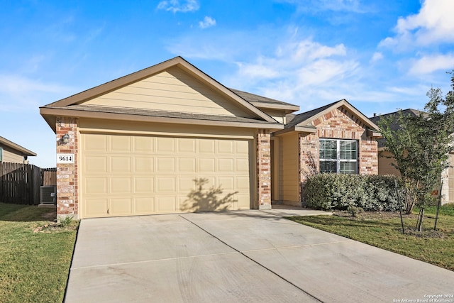 single story home with a front lawn and a garage