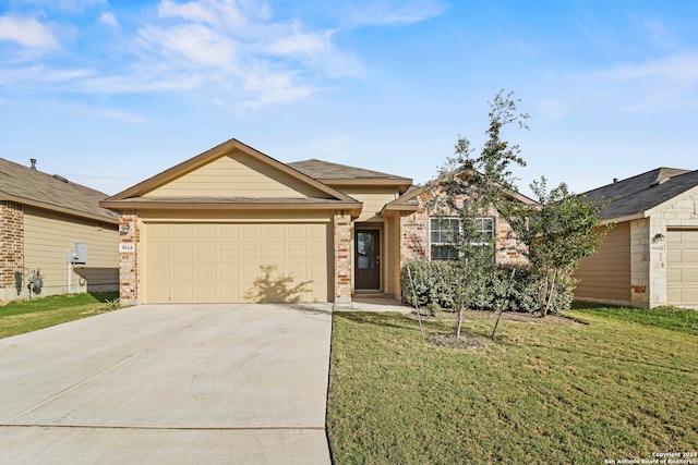 single story home with a garage and a front lawn