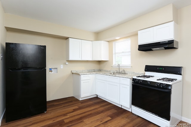 kitchen featuring black fridge, sink, white cabinetry, exhaust hood, and white range