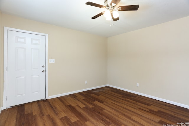 unfurnished room with ceiling fan and dark hardwood / wood-style floors