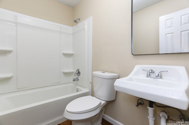 bathroom featuring  shower combination and toilet