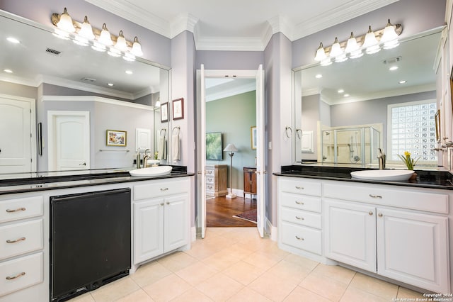 bathroom featuring wood-type flooring, vanity, crown molding, and a shower with door