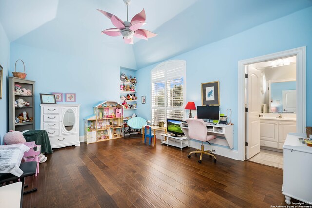 office featuring vaulted ceiling, dark hardwood / wood-style flooring, and ceiling fan