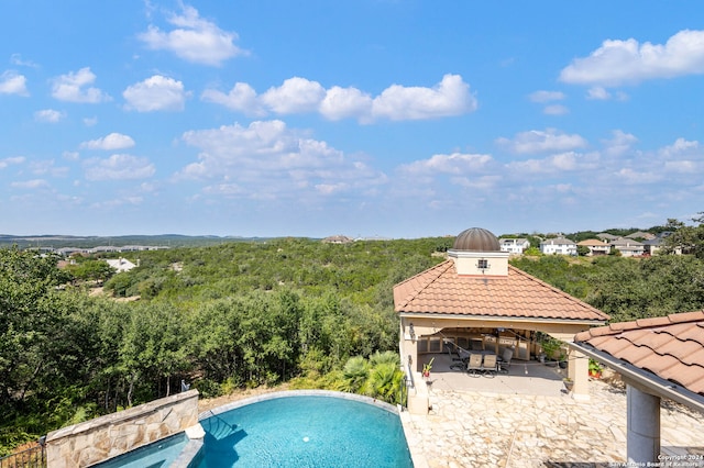 view of swimming pool featuring a patio area