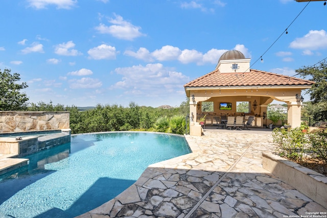 view of swimming pool featuring a gazebo and a patio area