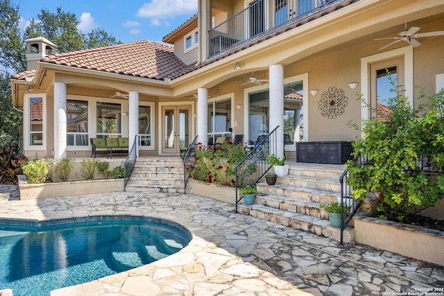 view of pool featuring ceiling fan and a patio