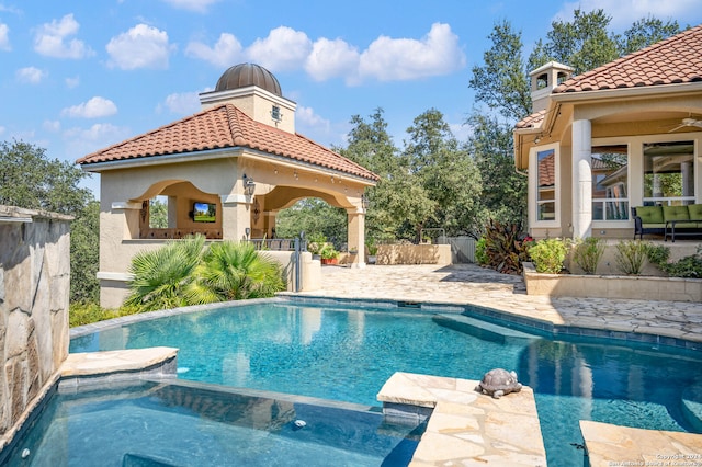 view of swimming pool featuring a gazebo and a patio