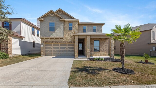 view of front of house with a front lawn and a garage