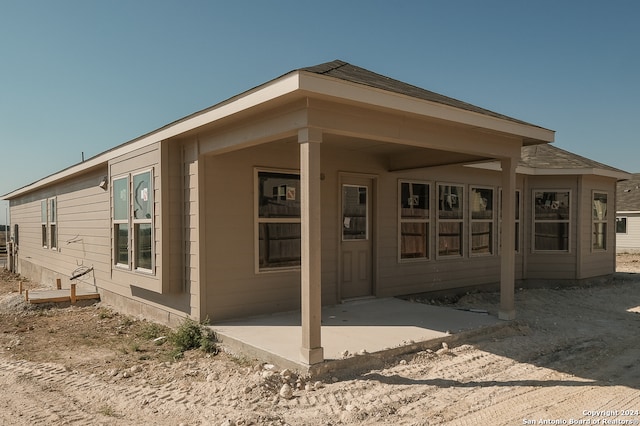 rear view of house featuring a patio