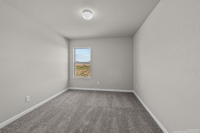 carpeted spare room with a textured ceiling