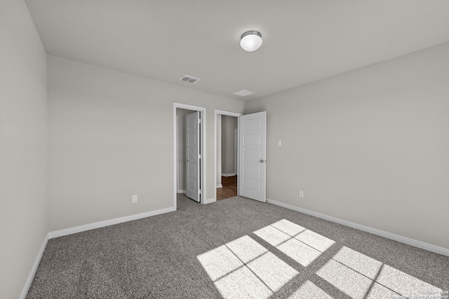 unfurnished bedroom with carpet floors